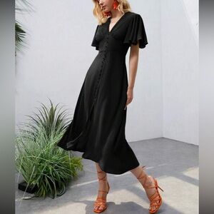 Luxe black button detail ruffle sleeve dress